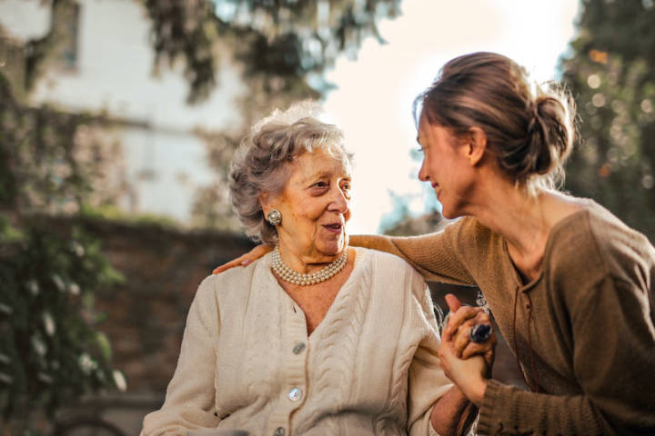 A daughter talking to her senior mother about moving to Assisted Living